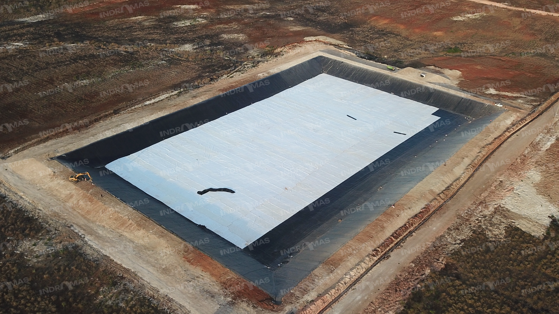Aerial view of a geomembrane covered lagoon
